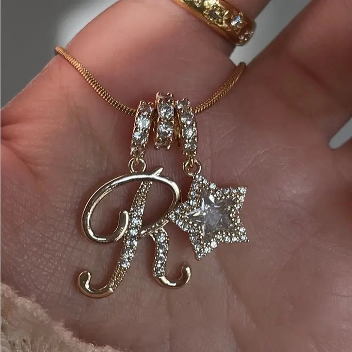 26-letter gold pendant with star decorations