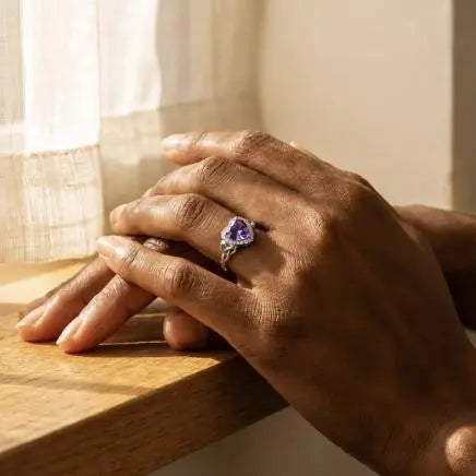 Purple heart stone ring with Celtic-inspired band details