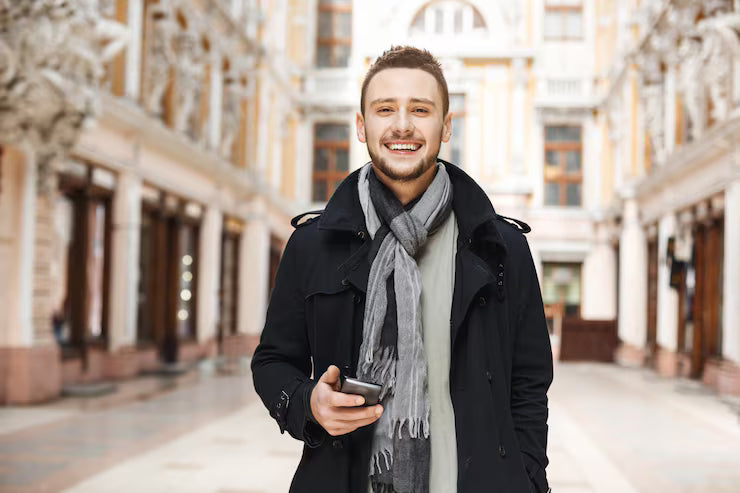 files/front-view-cheerful-man-holding-phone-looking-straight_176420-11748.avif