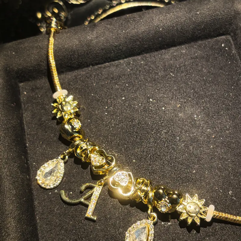 Close-up of initial bracelet charms